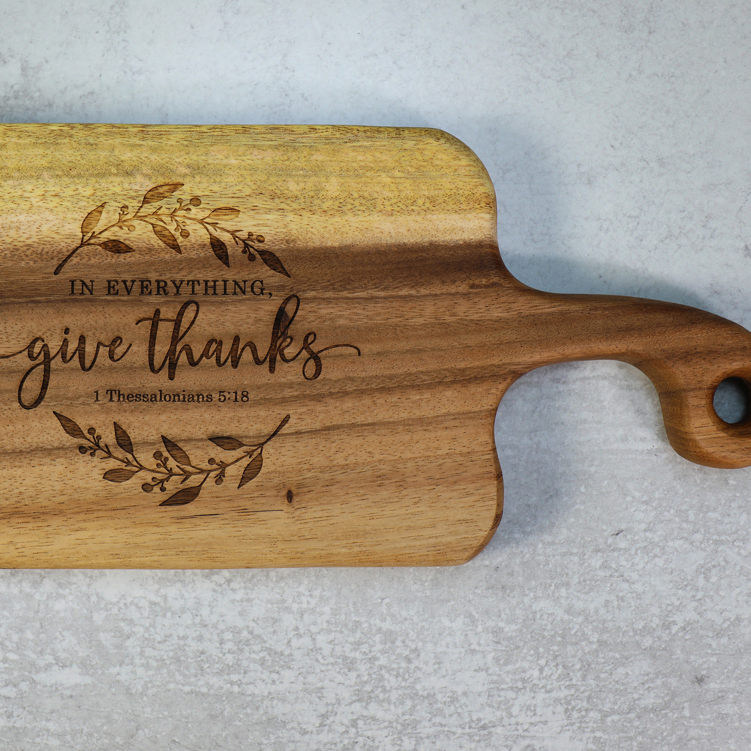 https://portalofhope.com/wp-content/uploads/2022/06/Tuckahoe-Hardwoods-GIVE-THANKS-Small-Walnut-Charcuterie-Cutting-Board-with-Handle-Main.jpg
